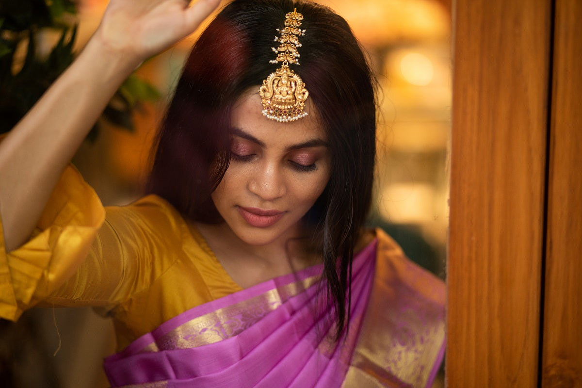 Gold Finish Nagasu Tikka mango motifs model with Lakshmi Carving Nagasu -Ruby