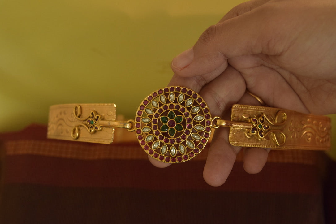 Gold finish flowered carving belt with pendant