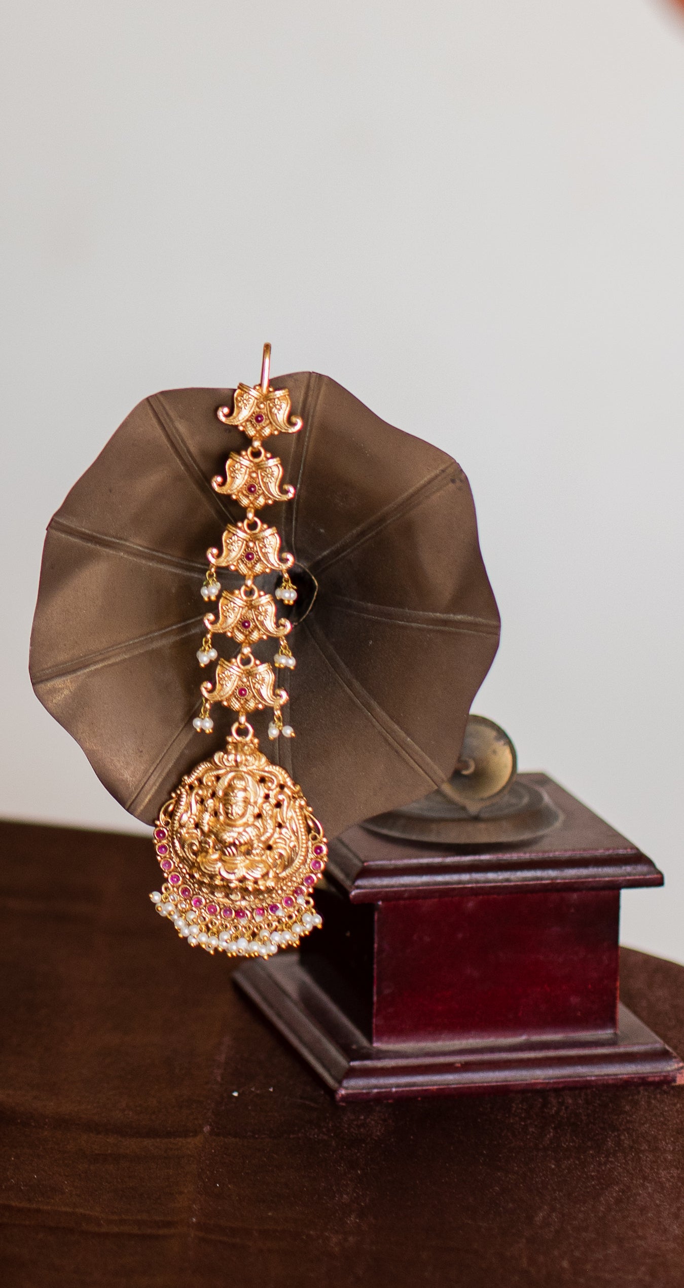 Gold Finish Nagasu Tikka mango motifs model with Lakshmi Carving Nagasu -Ruby