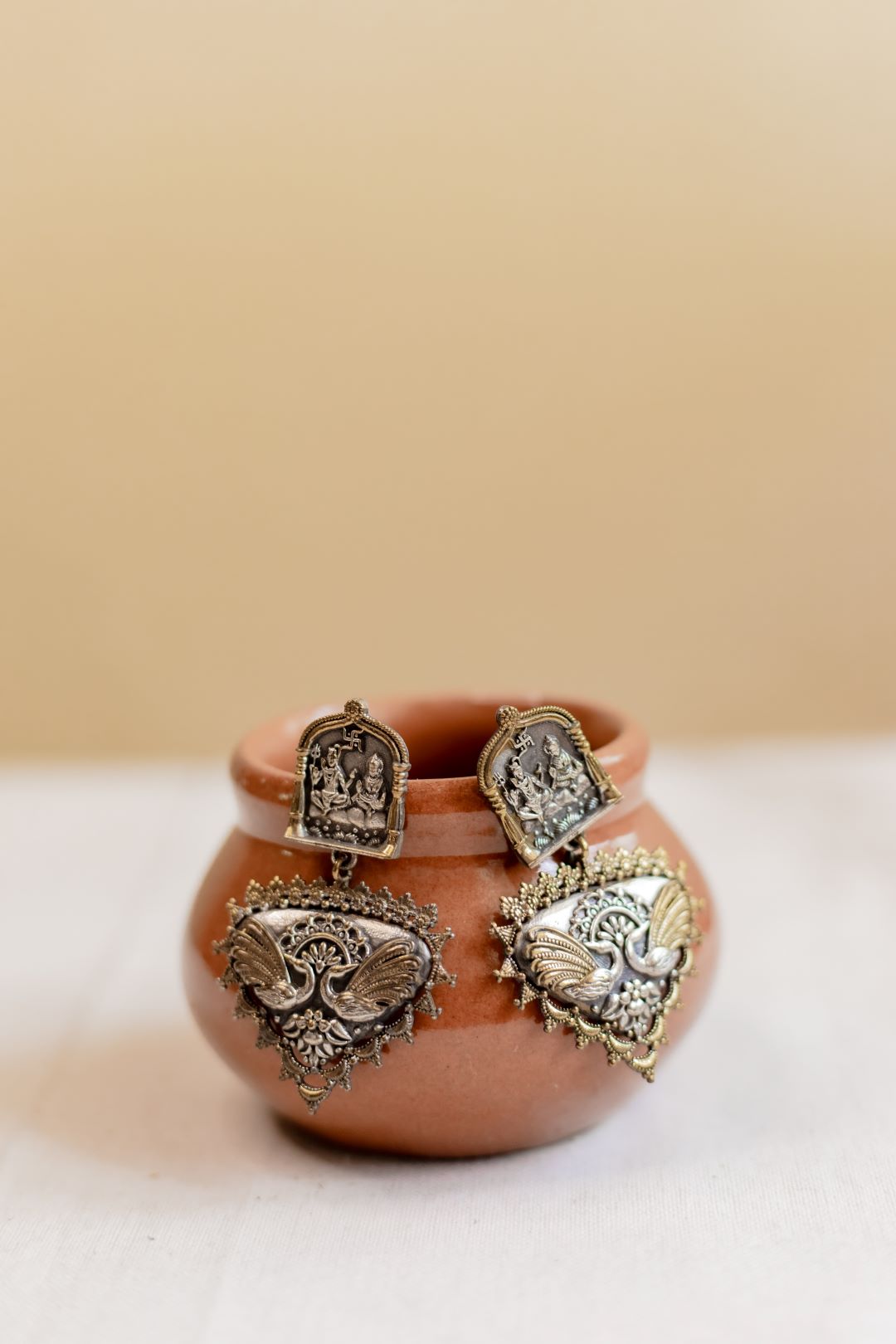 Dual Shivan parvathi Carving stud with peacock chandanbali