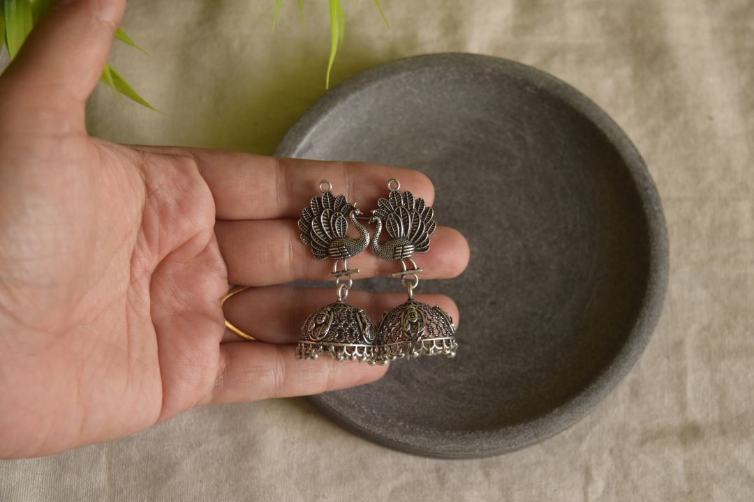 Silver Finish Peacock Stud with Sai baba carving jhumka