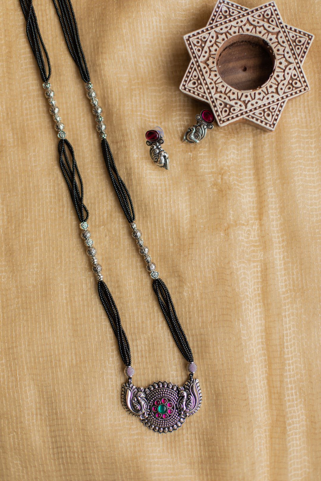 5 layered black beads with twin pecock chakri pendant