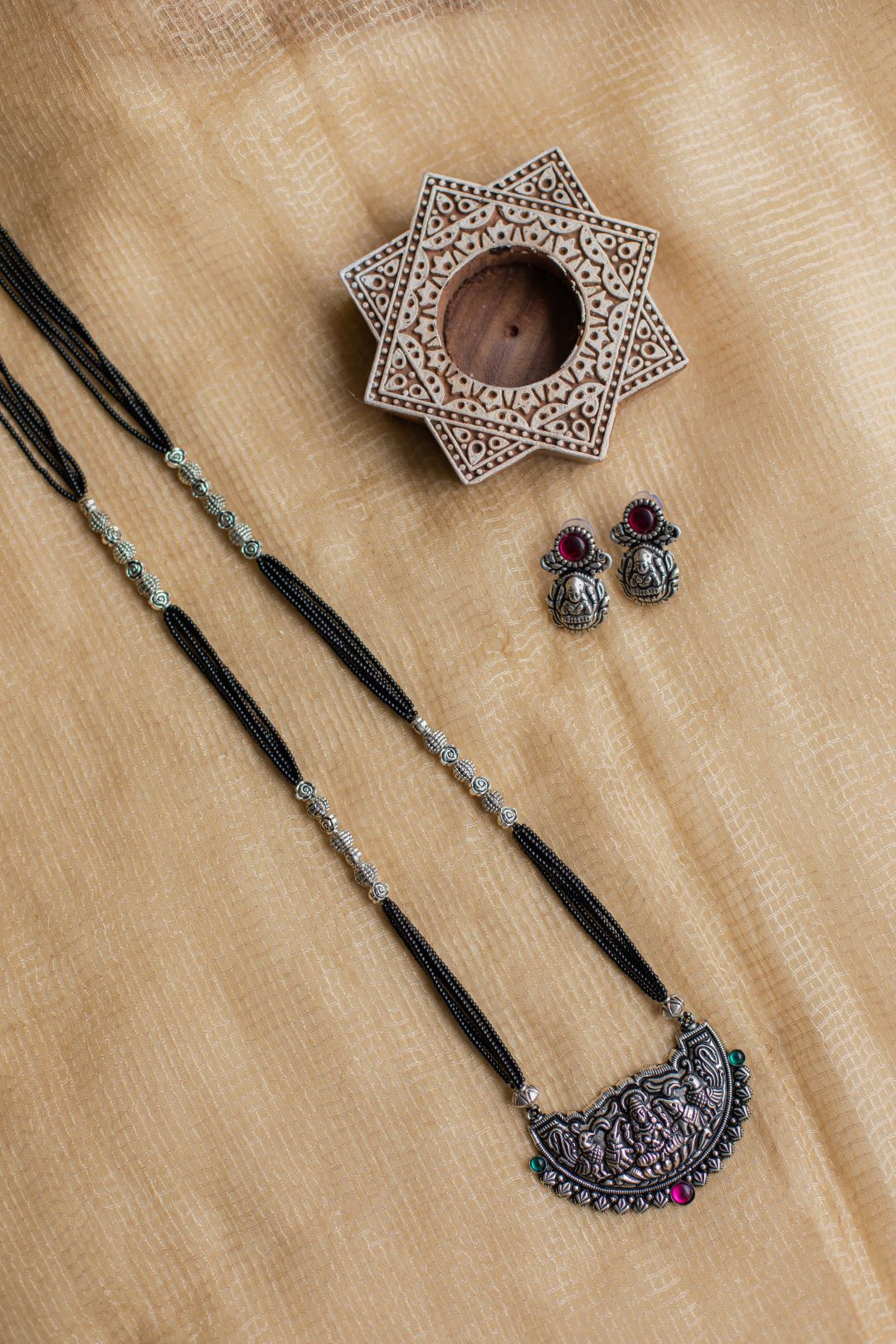 5 layered black beads with gaja lakshmi pendant
