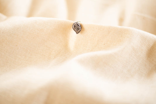 Silver finish tiny nose pin  - carved Mango lakshmi(Pierced)