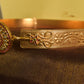 Gold finish flowered carving belt with pendant