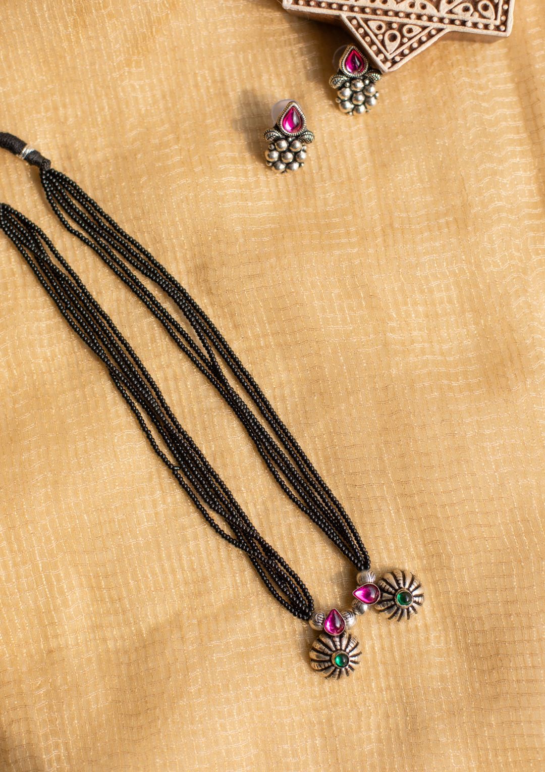 5 layered black beads with twin rain drops pendant with flower stud - pink & green