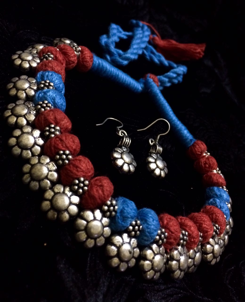 Blue and red thread  , flower sequence motifs