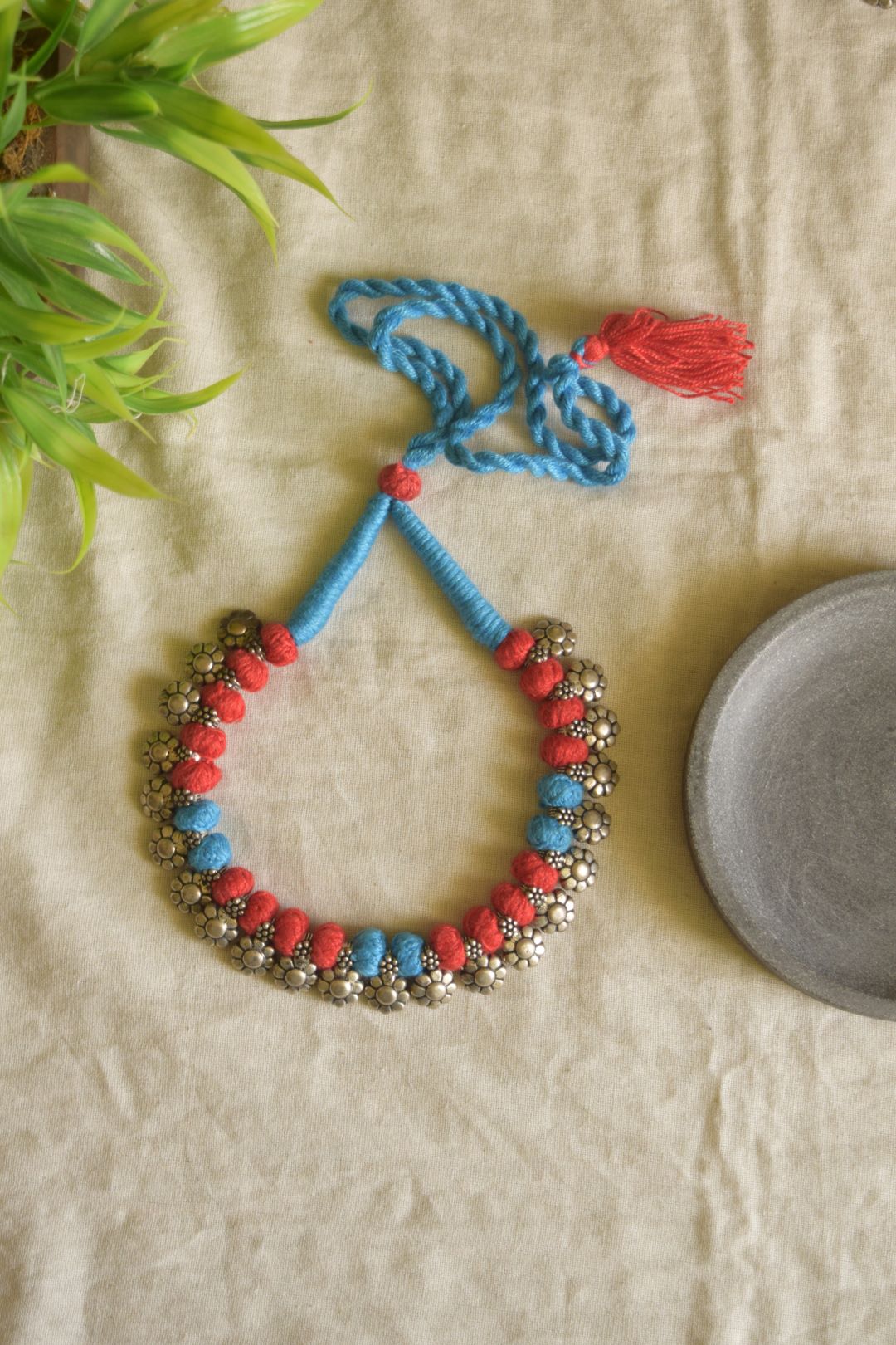 Blue and red thread  , flower sequence motifs