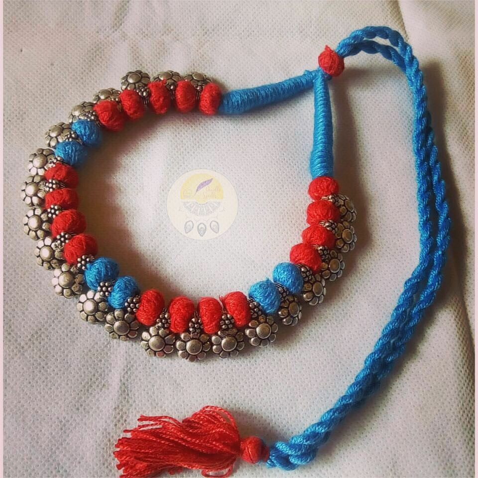 Blue and red thread  , flower sequence motifs