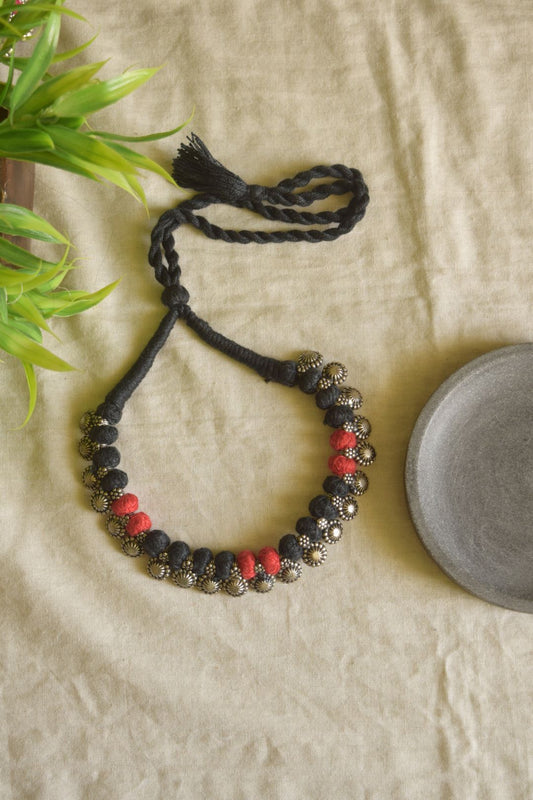 Red and black thread, flower sequence motifs