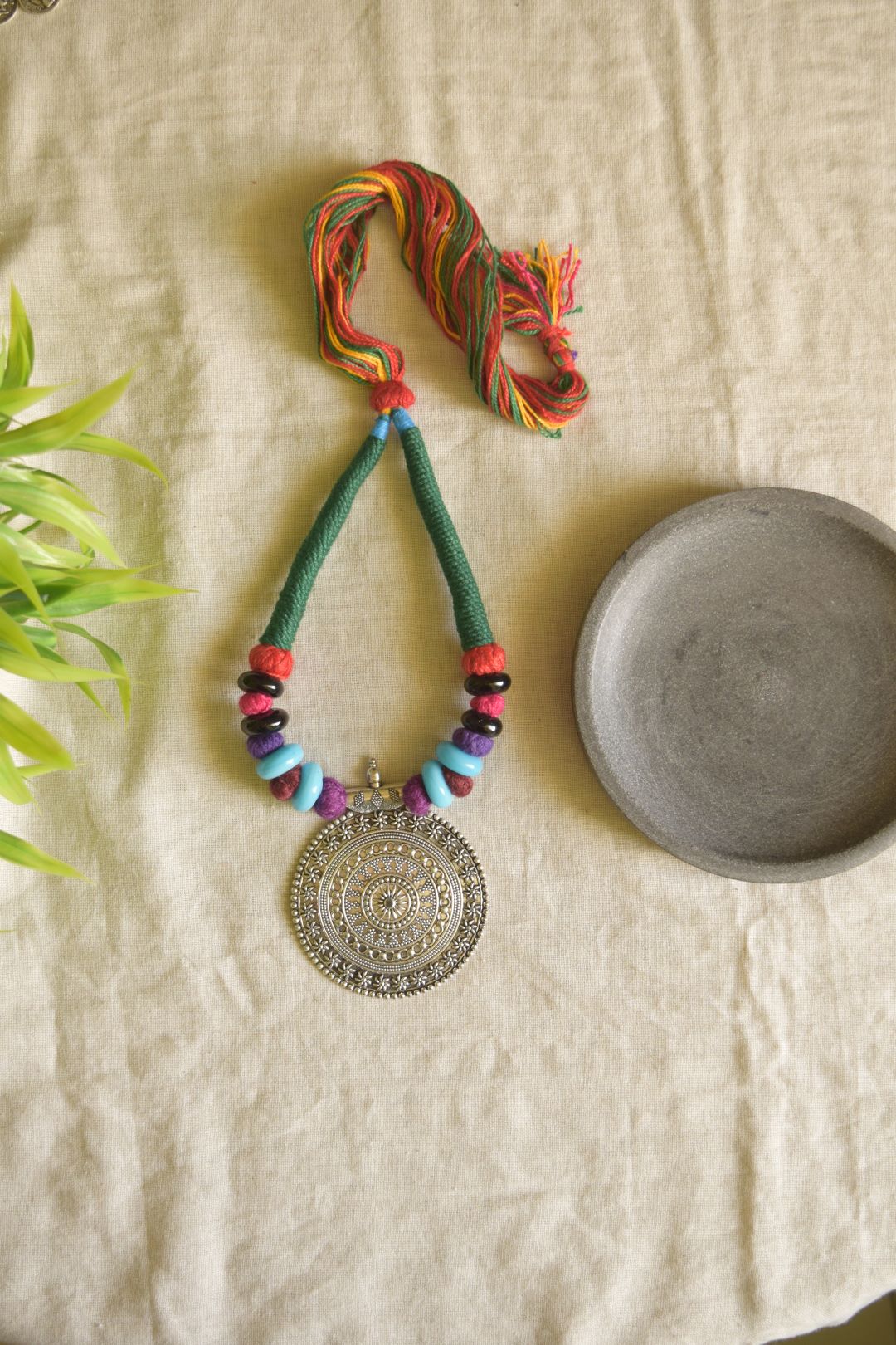 Green thread with jumbo chakri pendant  with  beads